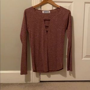 cute long sleeved shirt with opening in the front.